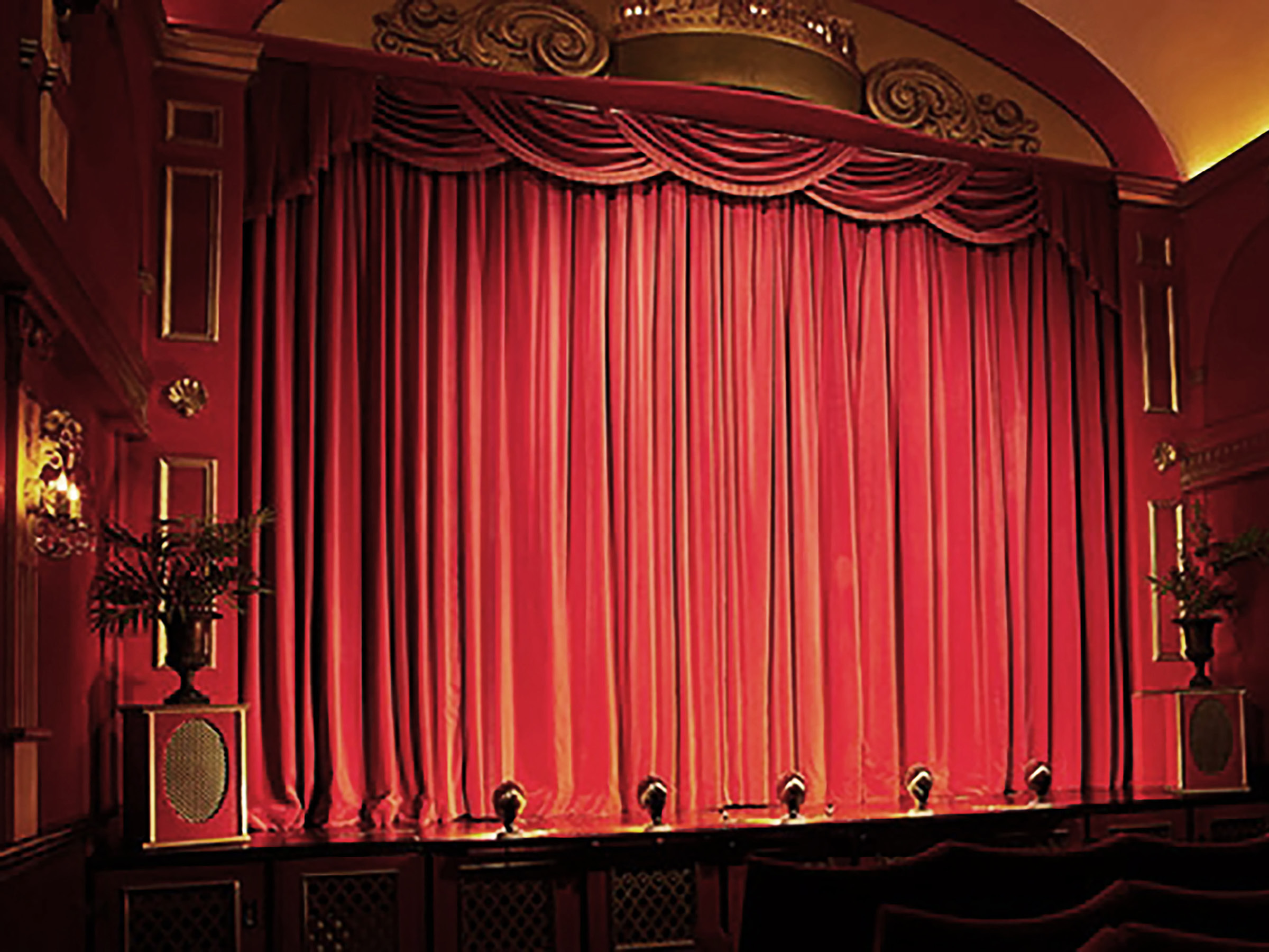 theatre stage in suffolk with red curtain