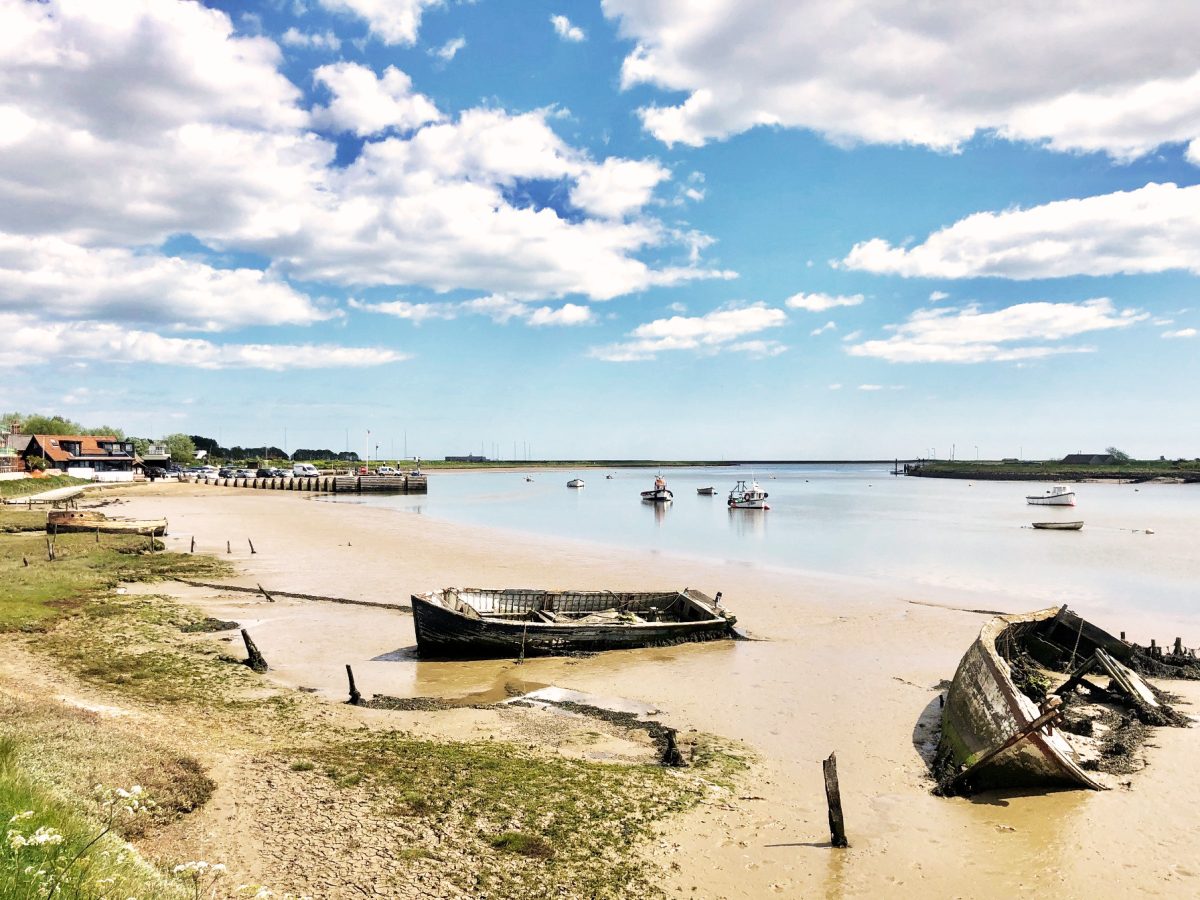 boats washed up on the beach in orford suffolk