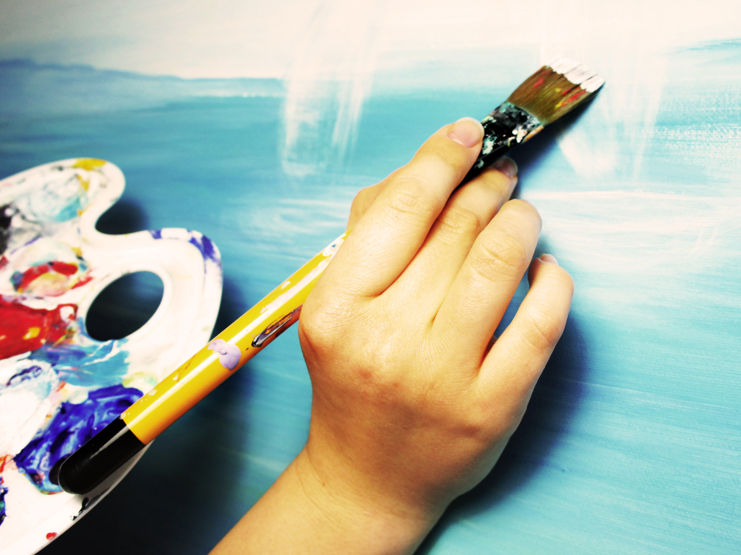 person painting at an art class in suffolk