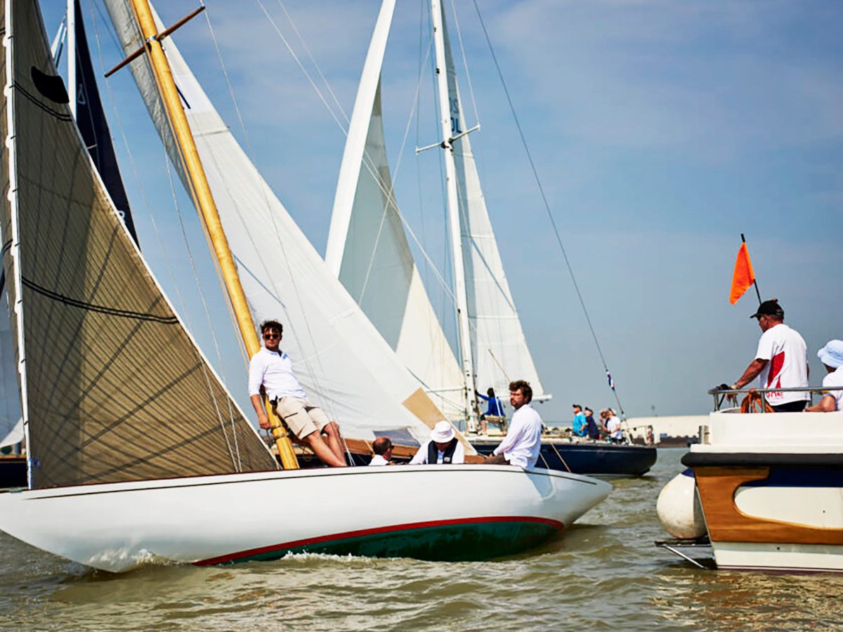 people relaxing on yachts in suffolk harbour